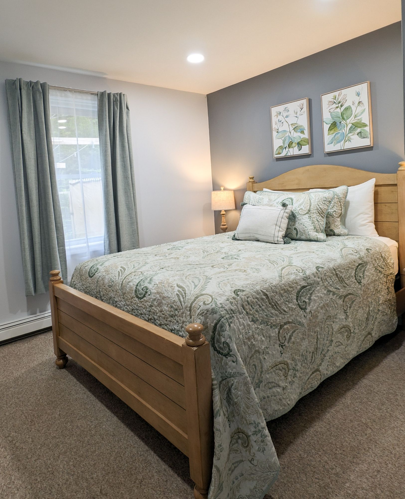 A bedroom with a large bed and a window
