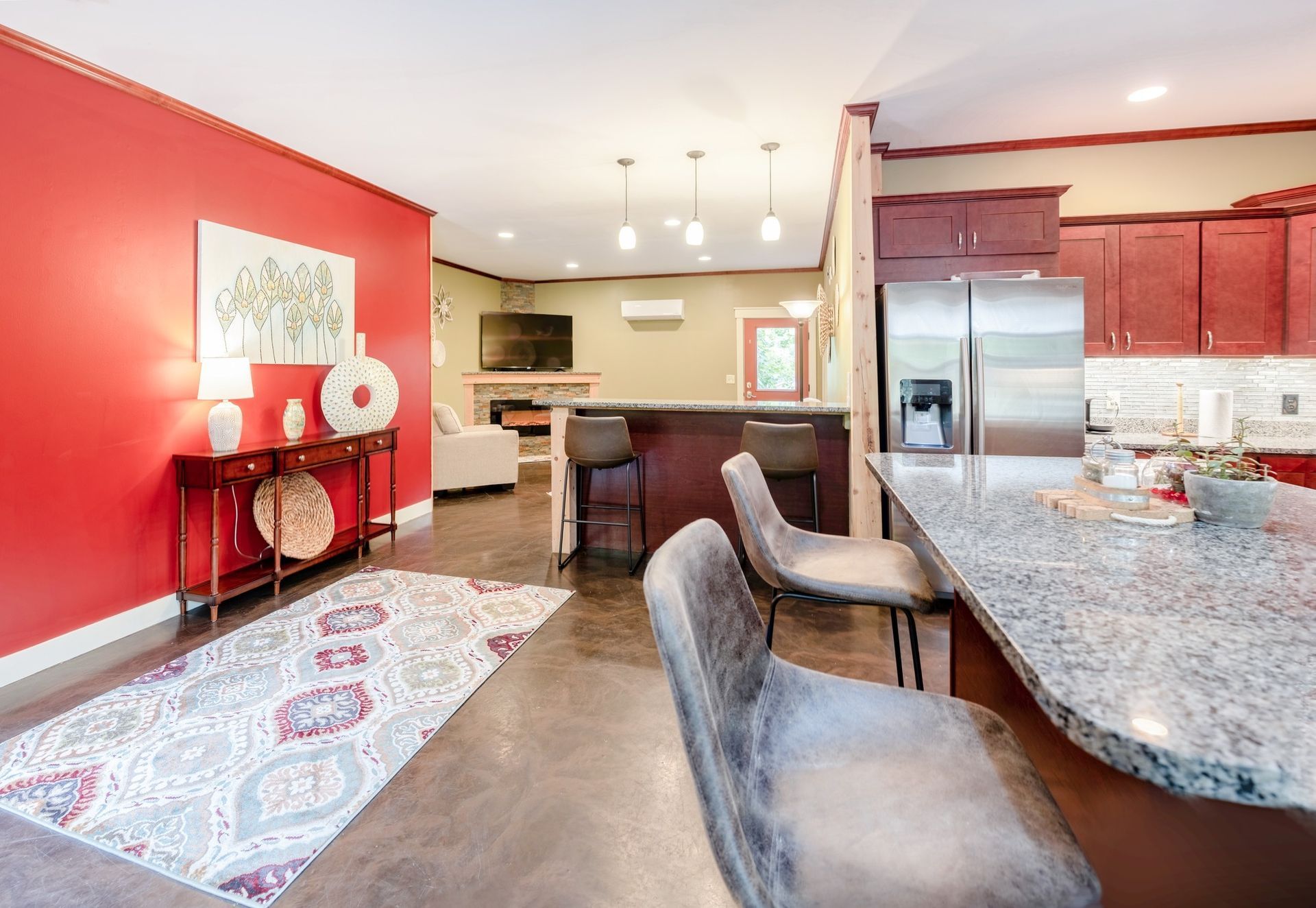 A kitchen with stainless steel appliances and granite counter tops.