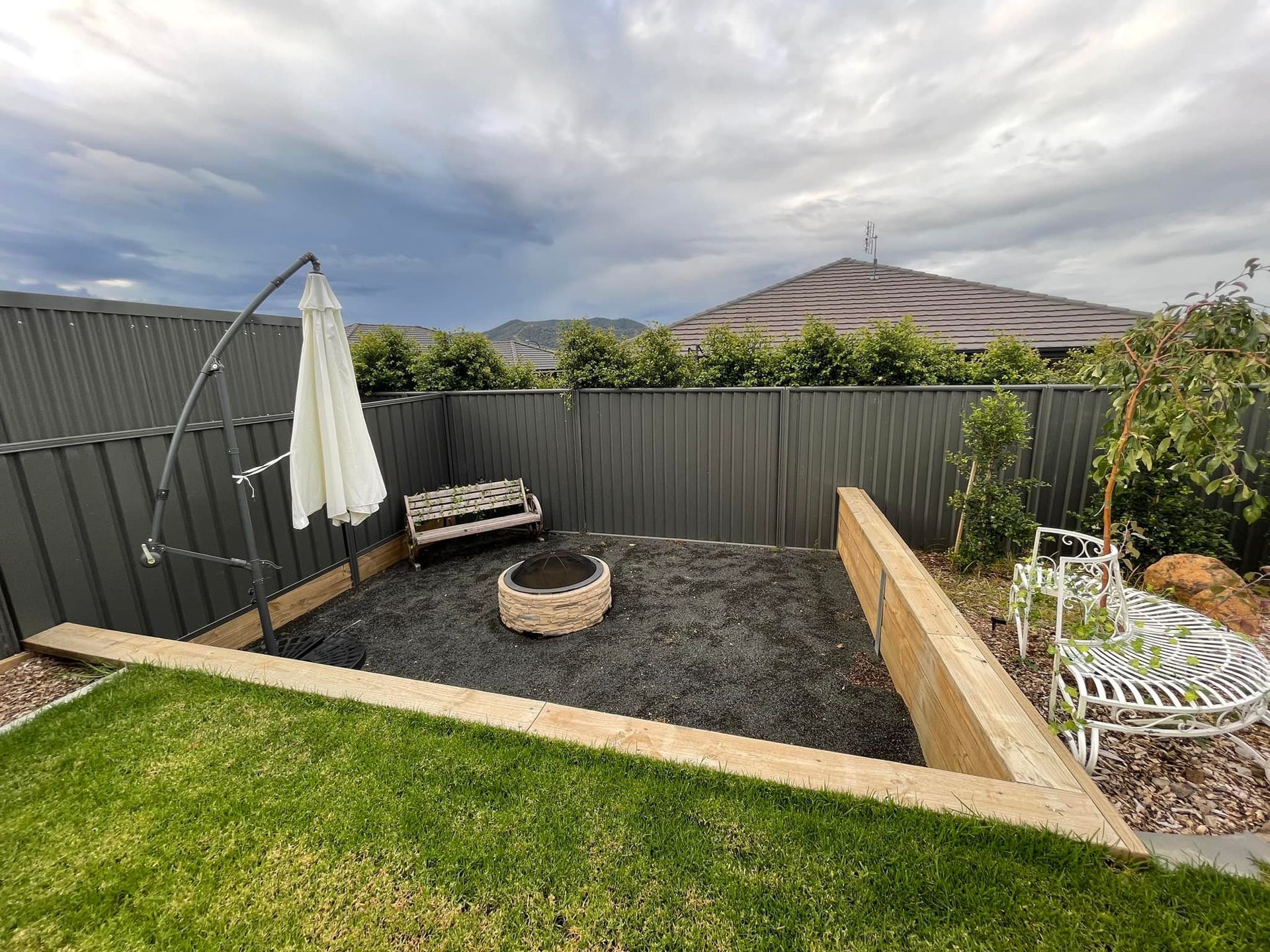 Fire Pit In The Middle Of The Backyard — Tamworth, NSW — Nathan Love’s Homes