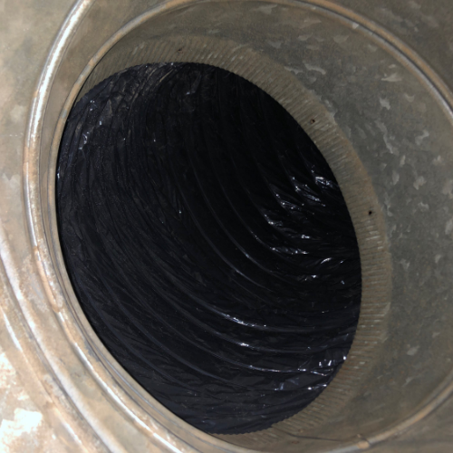 A close up of a metal pipe with a hole in the middle