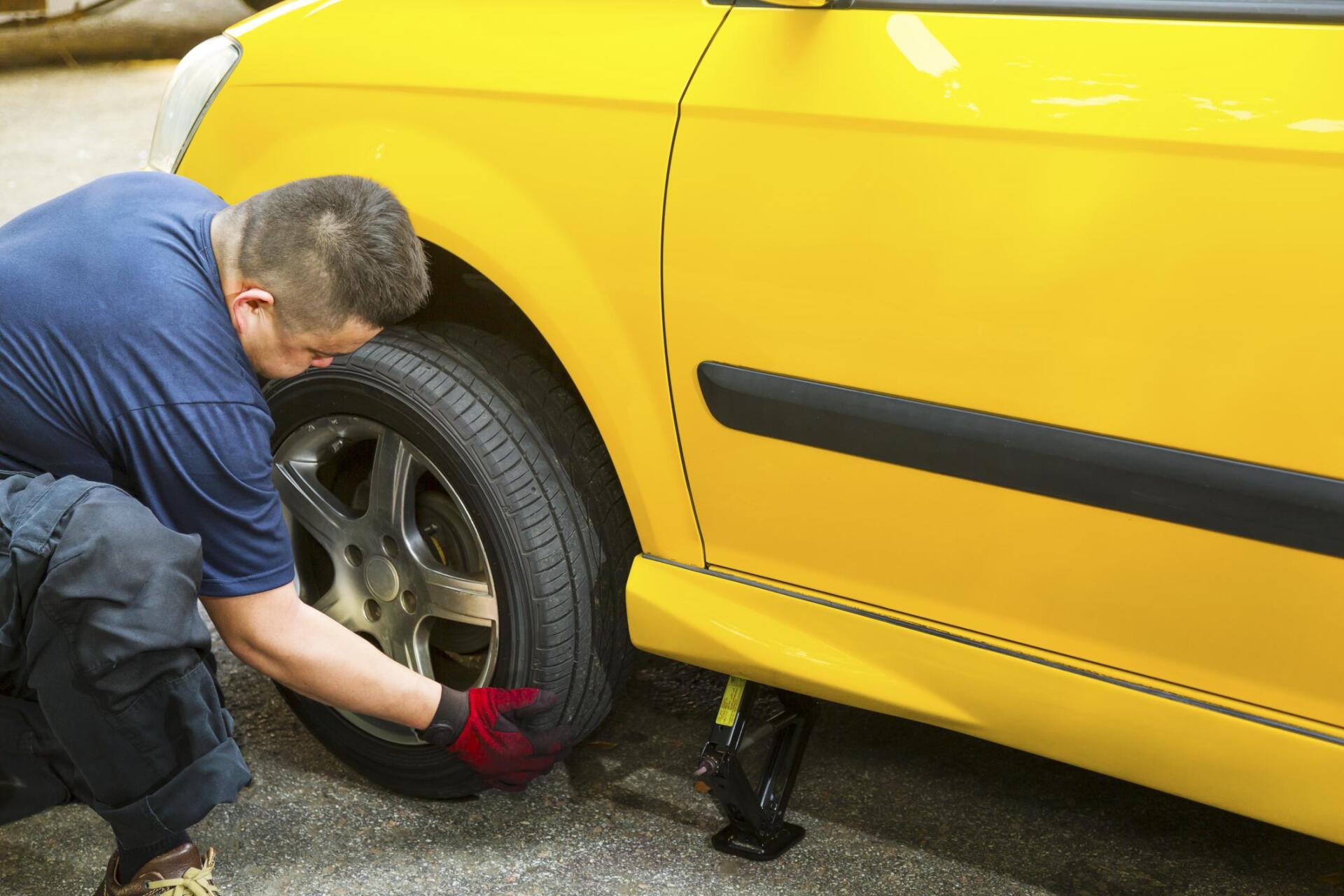 man changing the car tire