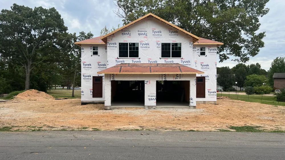 A house is being built on the side of the road.