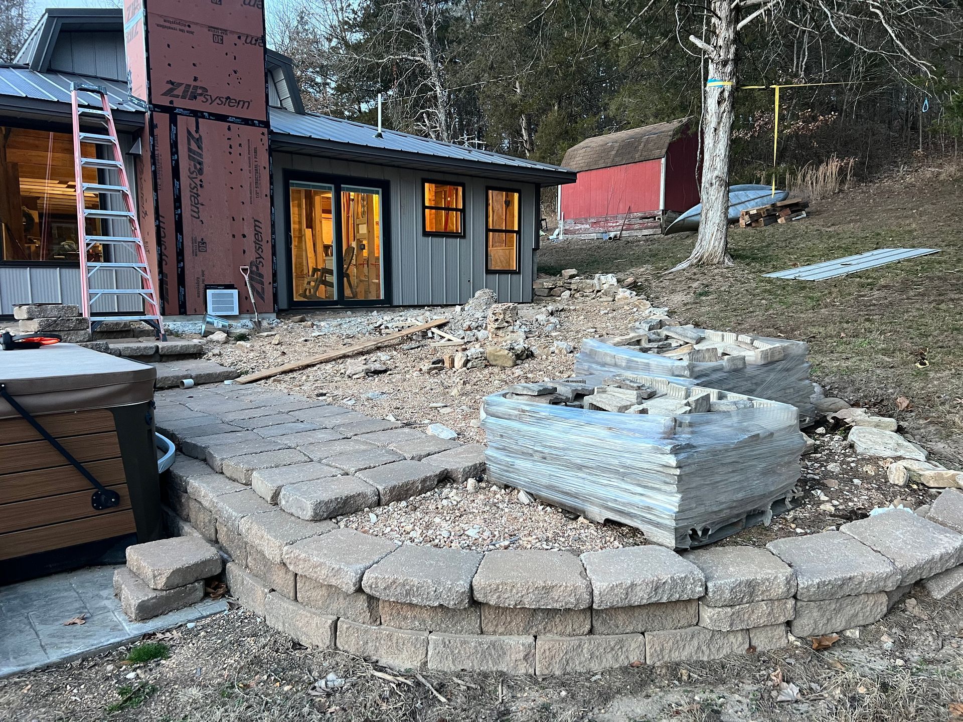 A concrete driveway is being built in front of a house.