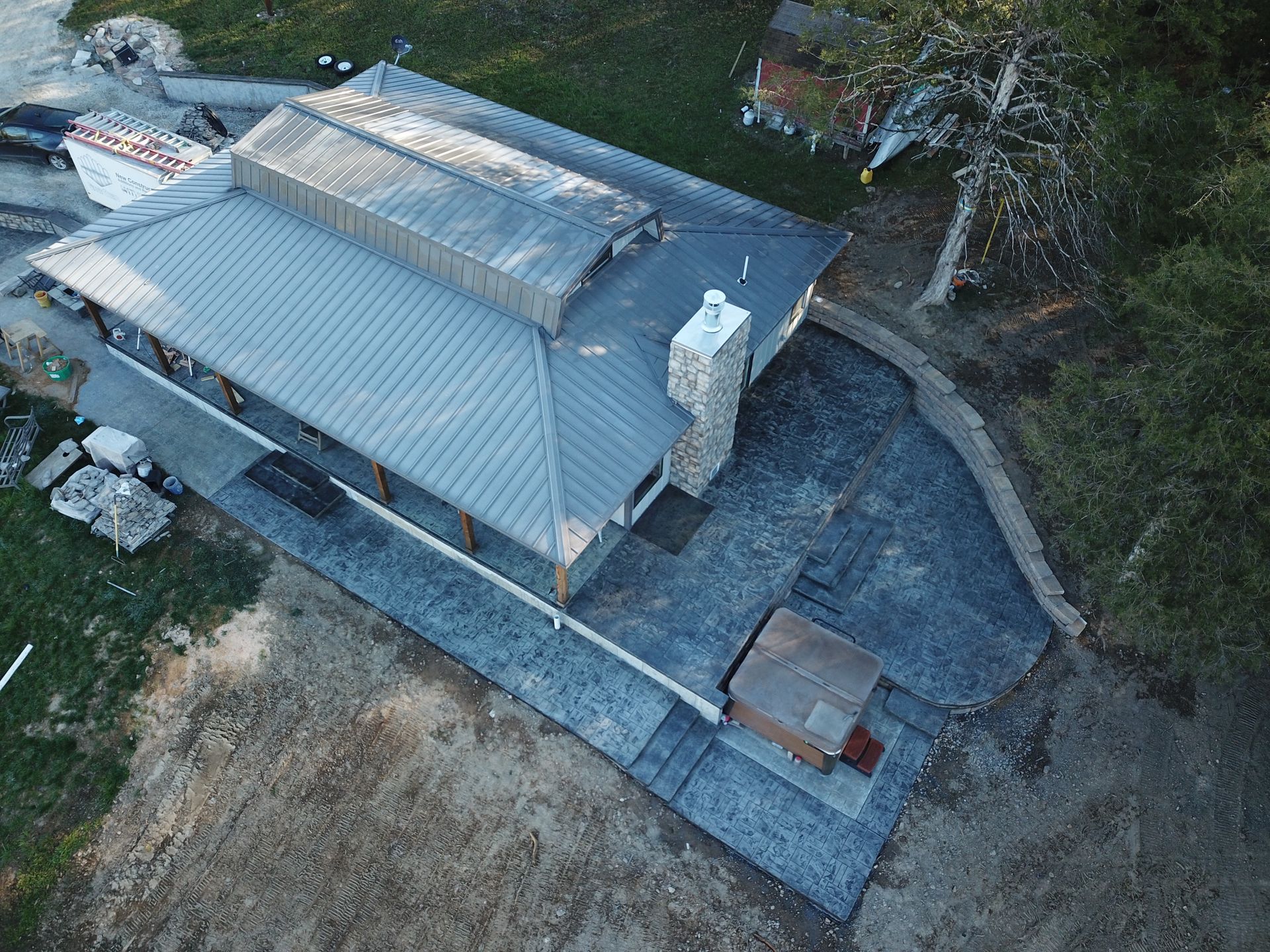 A large concrete slab is sitting on top of a gravel road.