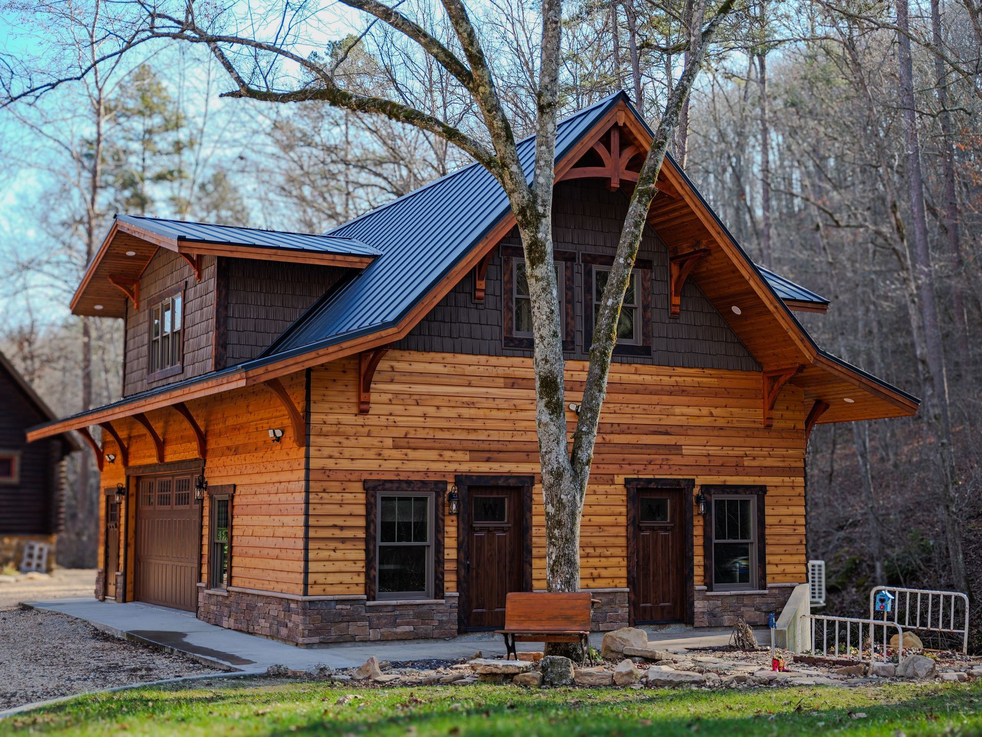A person is standing on top of a wooden roof.