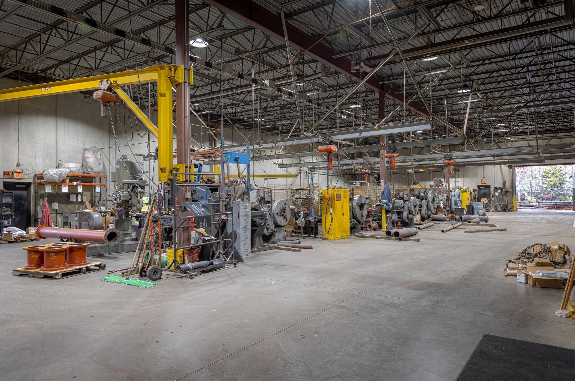 A large warehouse with a lot of machinery in it