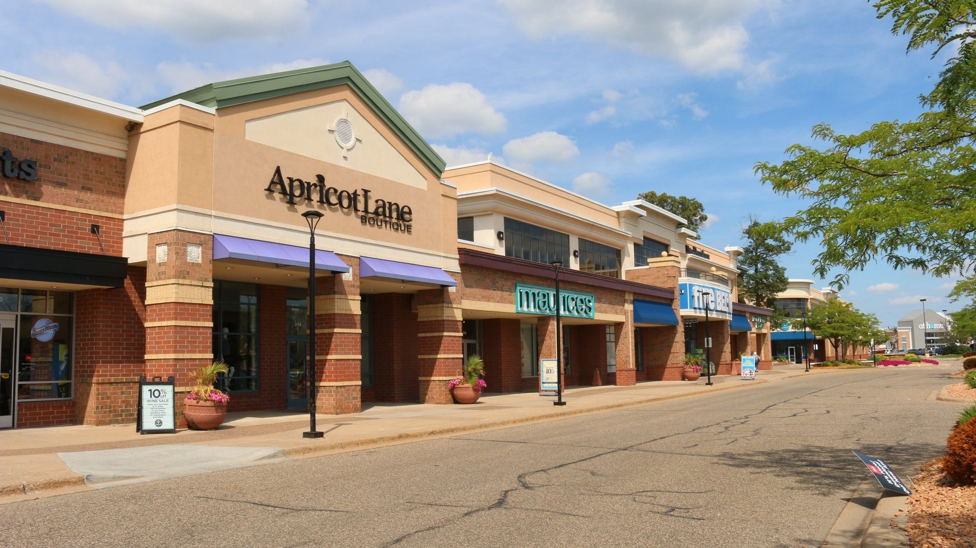 A row of shops with one that says apricotlune