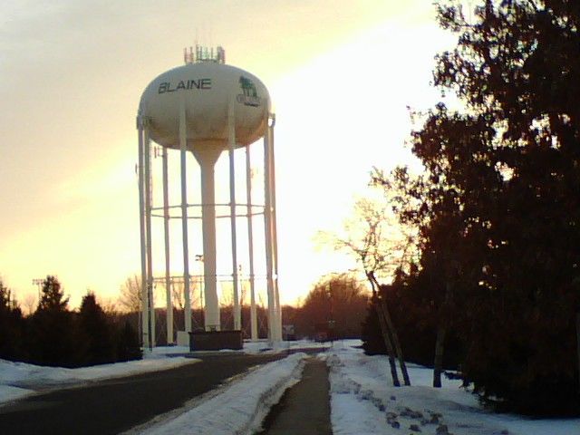 A water tower with the word blaine on it
