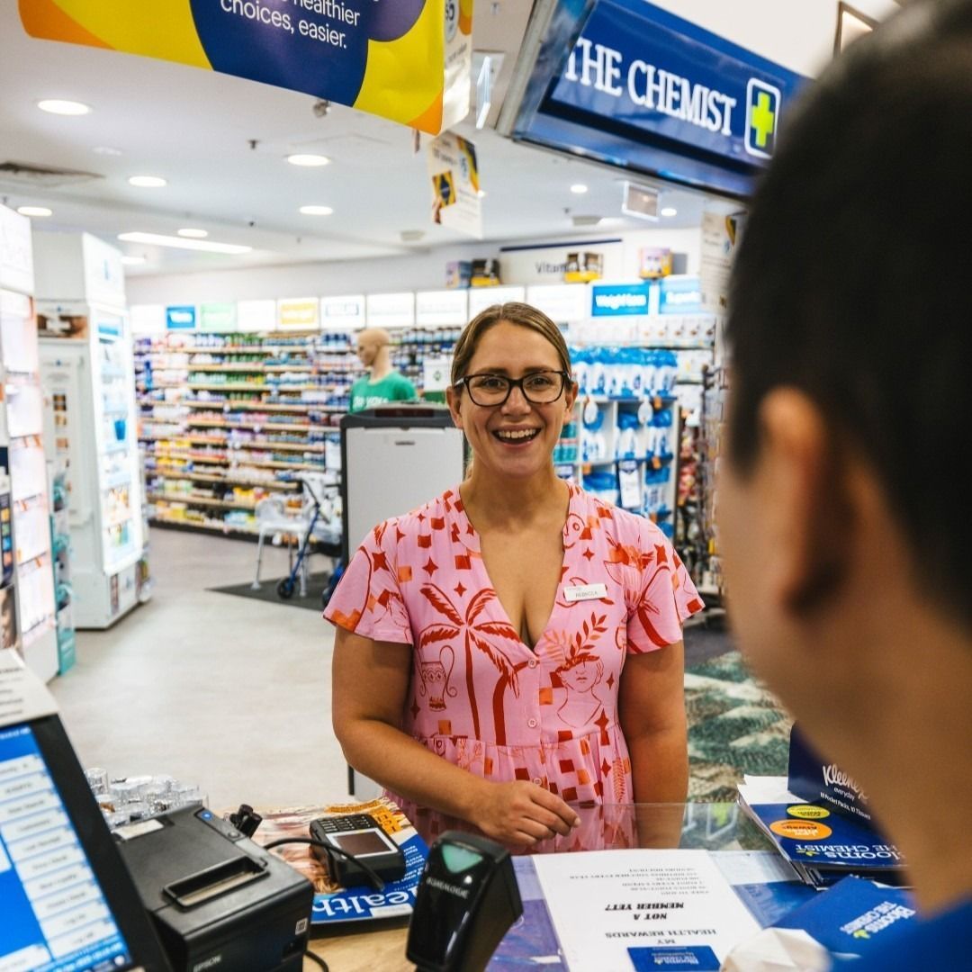 Pharmacist Smiling at Customer at a Pharmacy Counter — Blooms The Chemist Sawtell in Sawtell, NSW