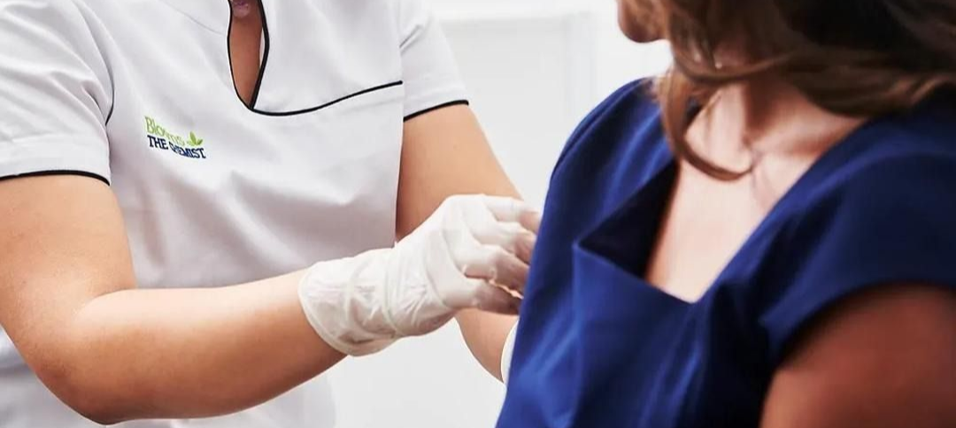 A Medical Professional in Gloves Preparing to Give a Shot to a Patient — Blooms The Chemist Sawtell in Sawtell, NSW