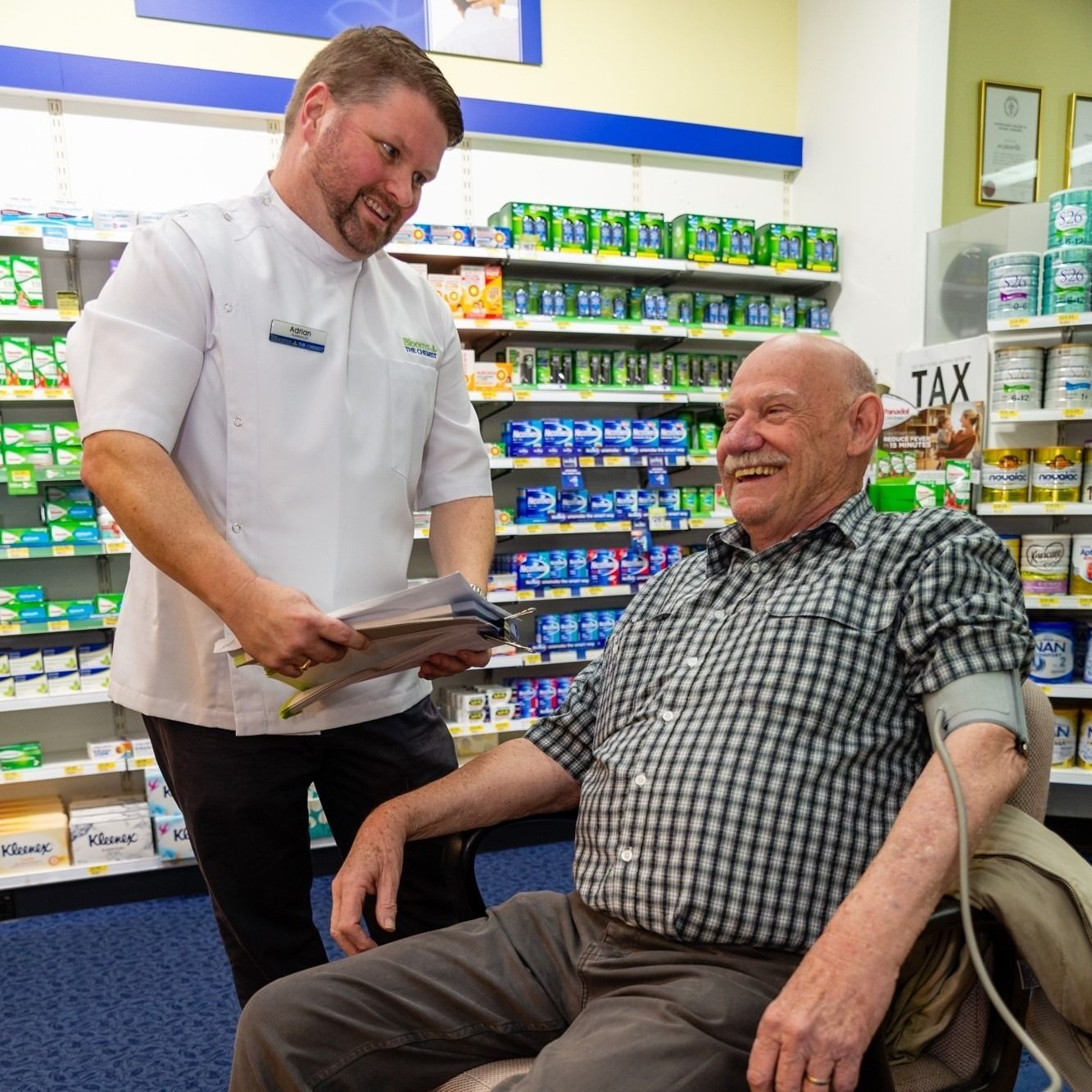 Pharmacist Takes a Patient's Blood Pressure in a Pharmacy — Blooms The Chemist Sawtell in Sawtell, NSW