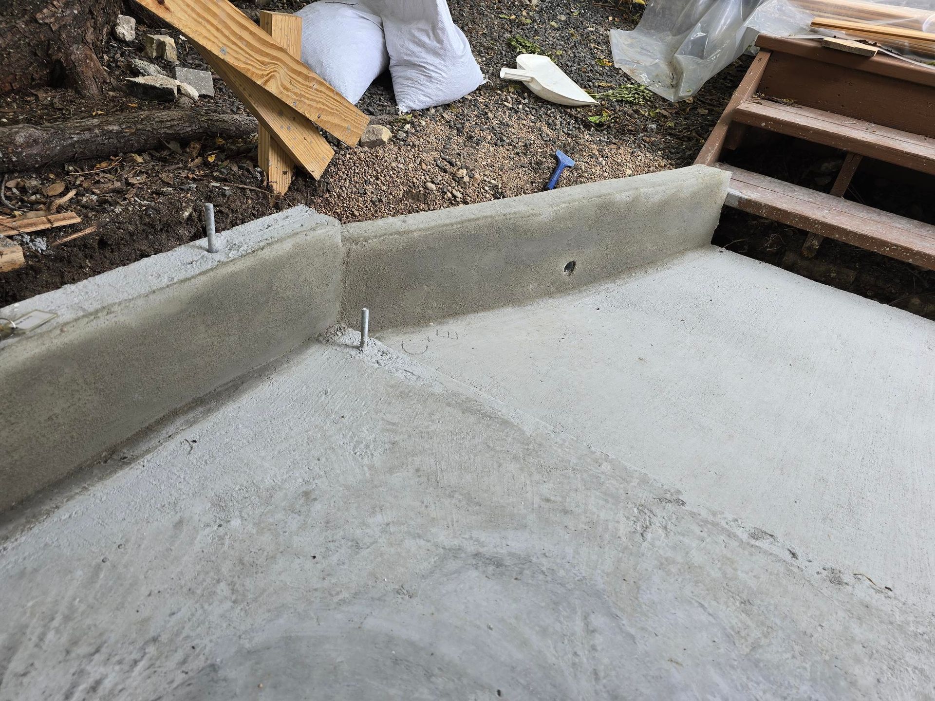 A row of houses with a white picket fence in a residential neighborhood.
