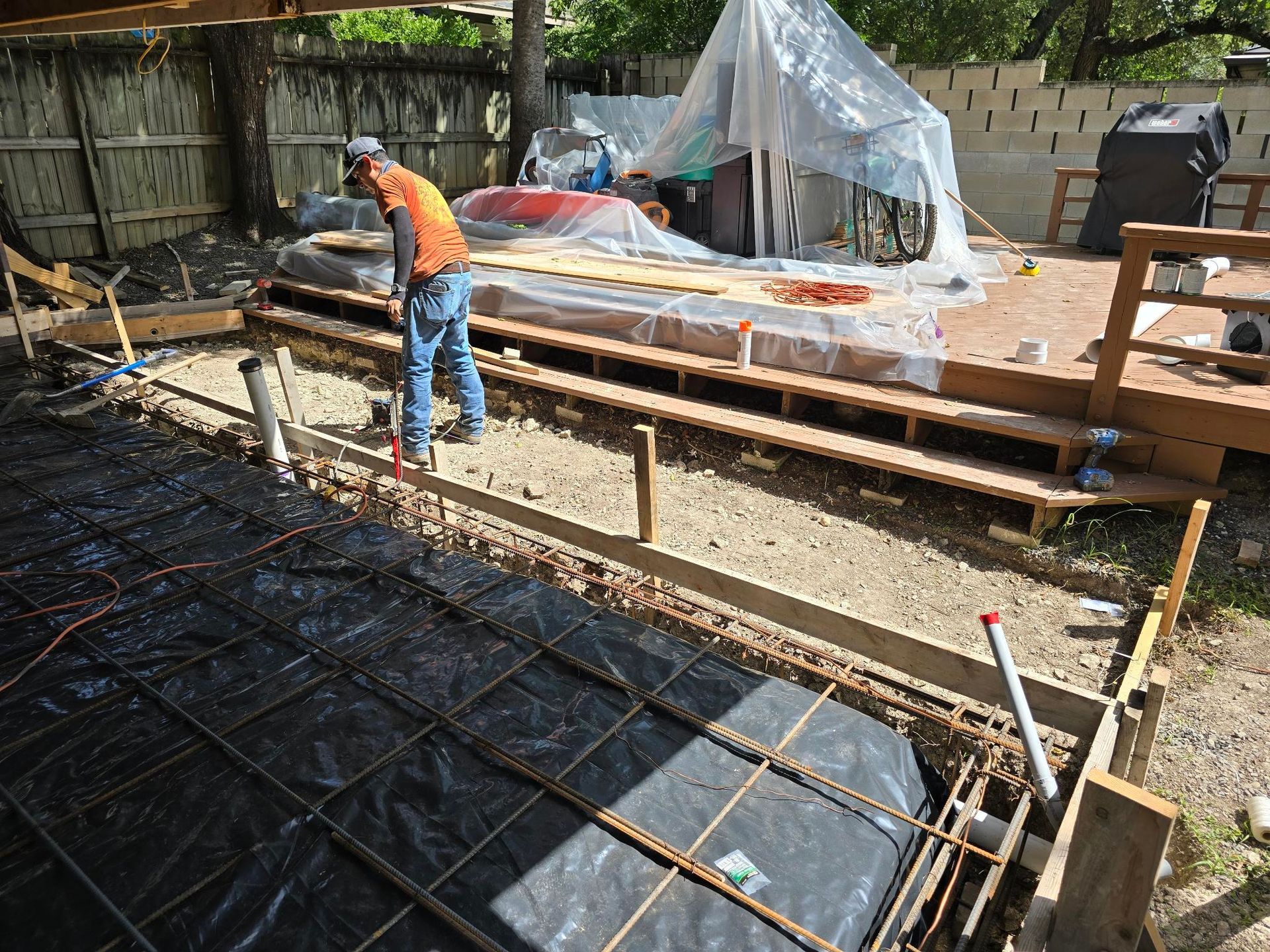 A row of houses with a white picket fence in a residential neighborhood.