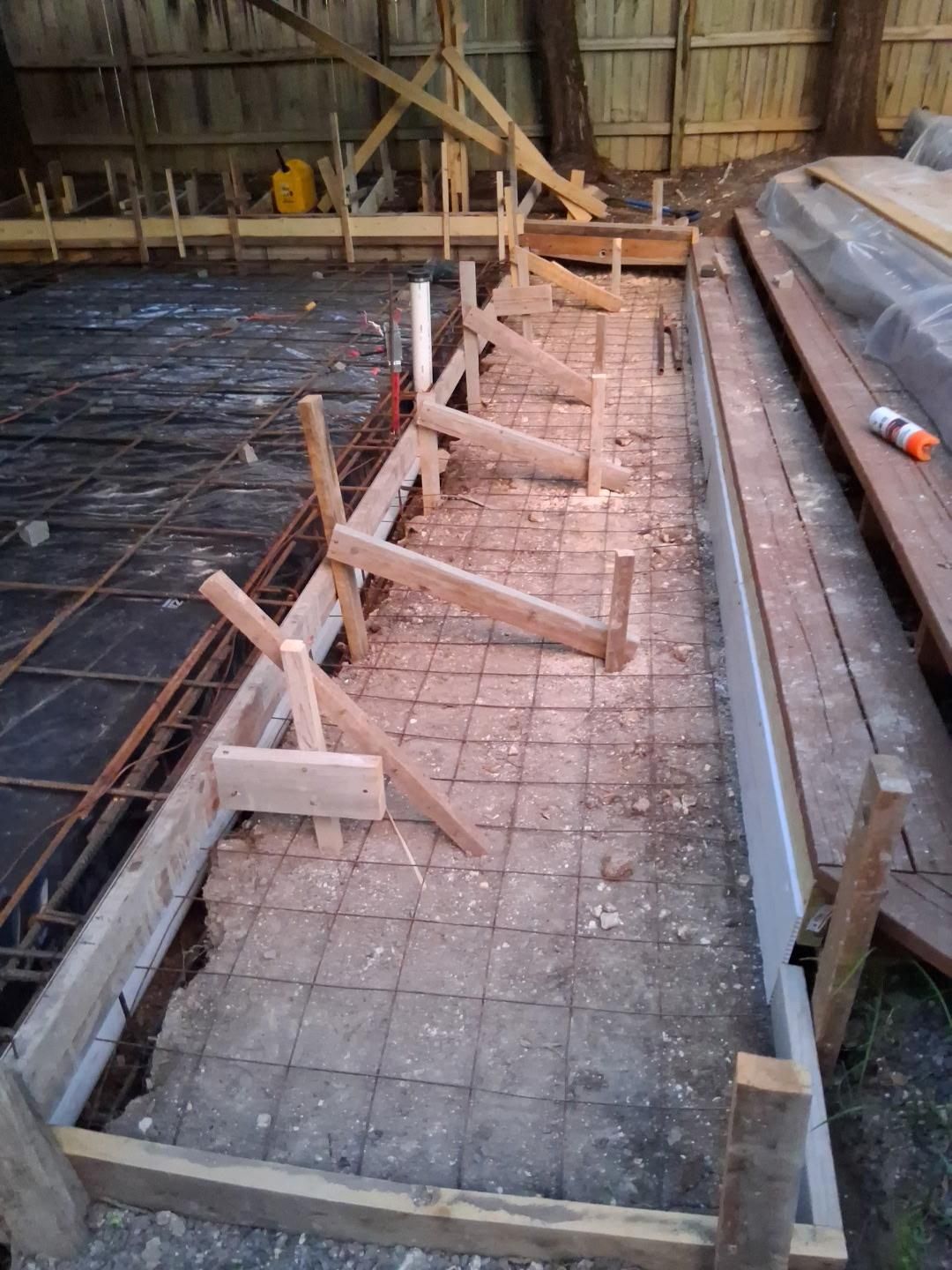 A room with a concrete floor and a window.