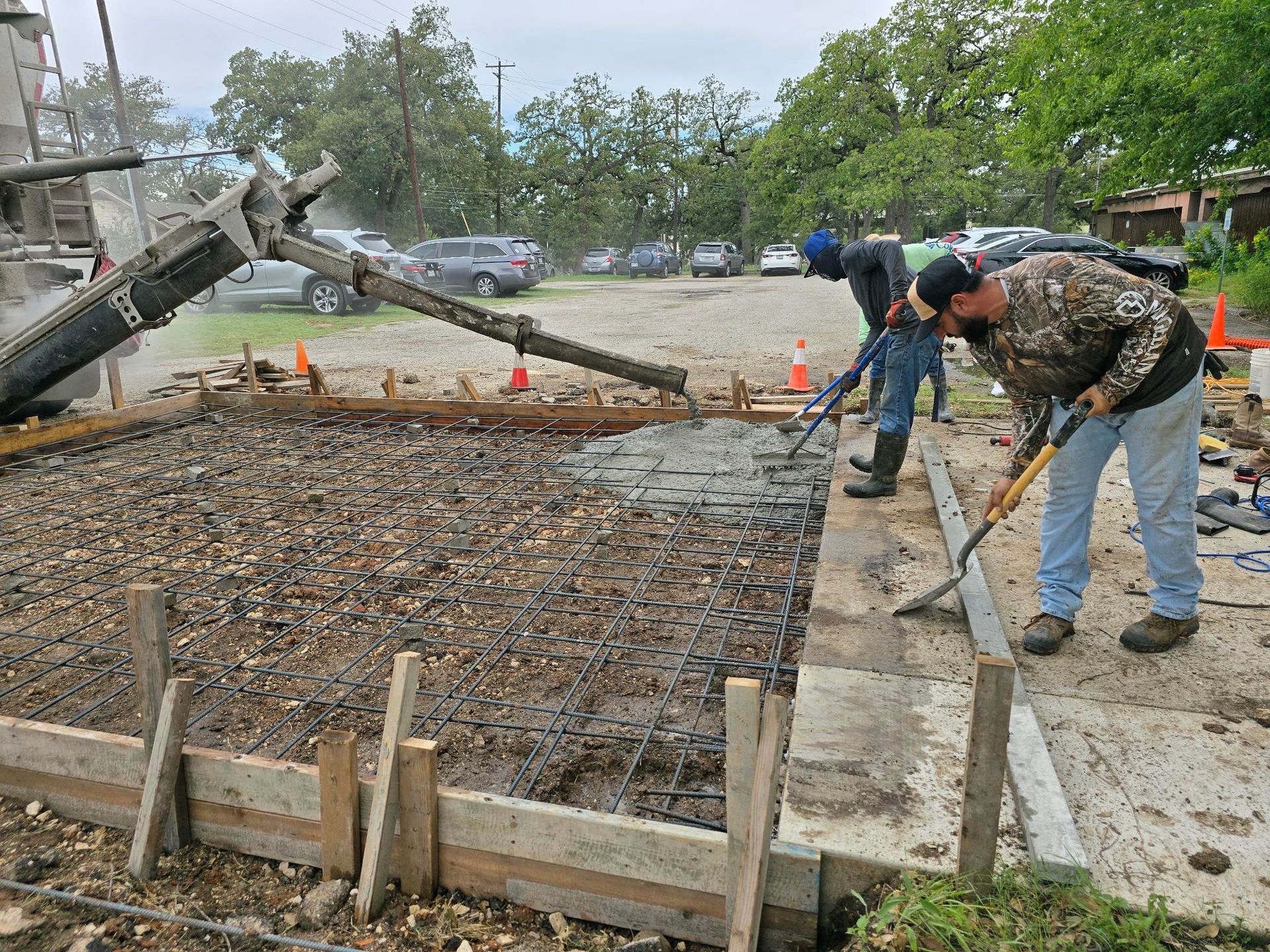 A concrete foundation is being built in a residential area.