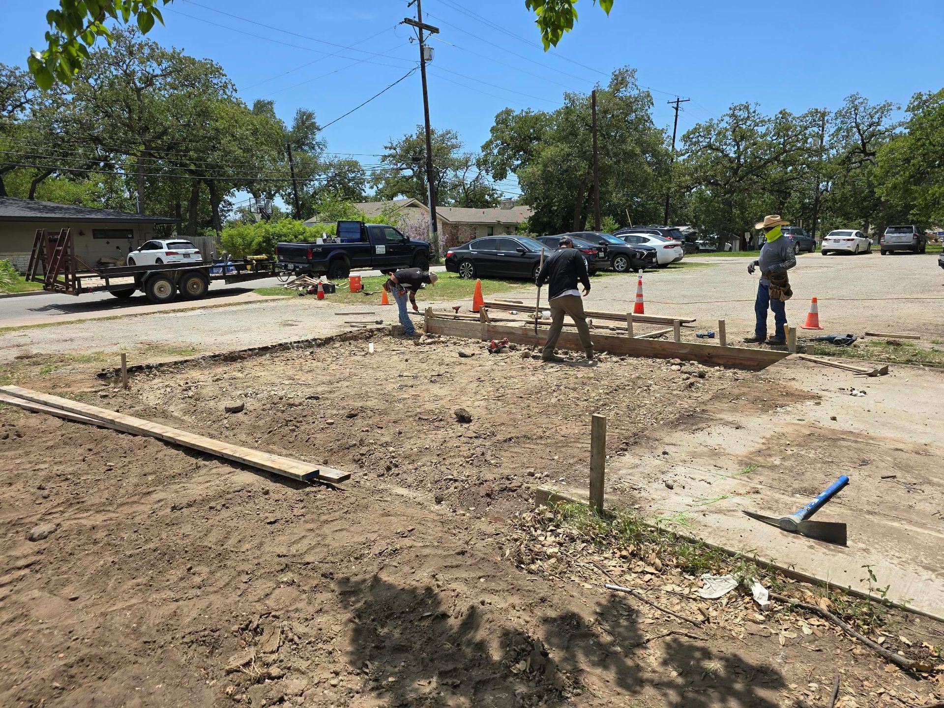 A concrete foundation is being built in a residential area.