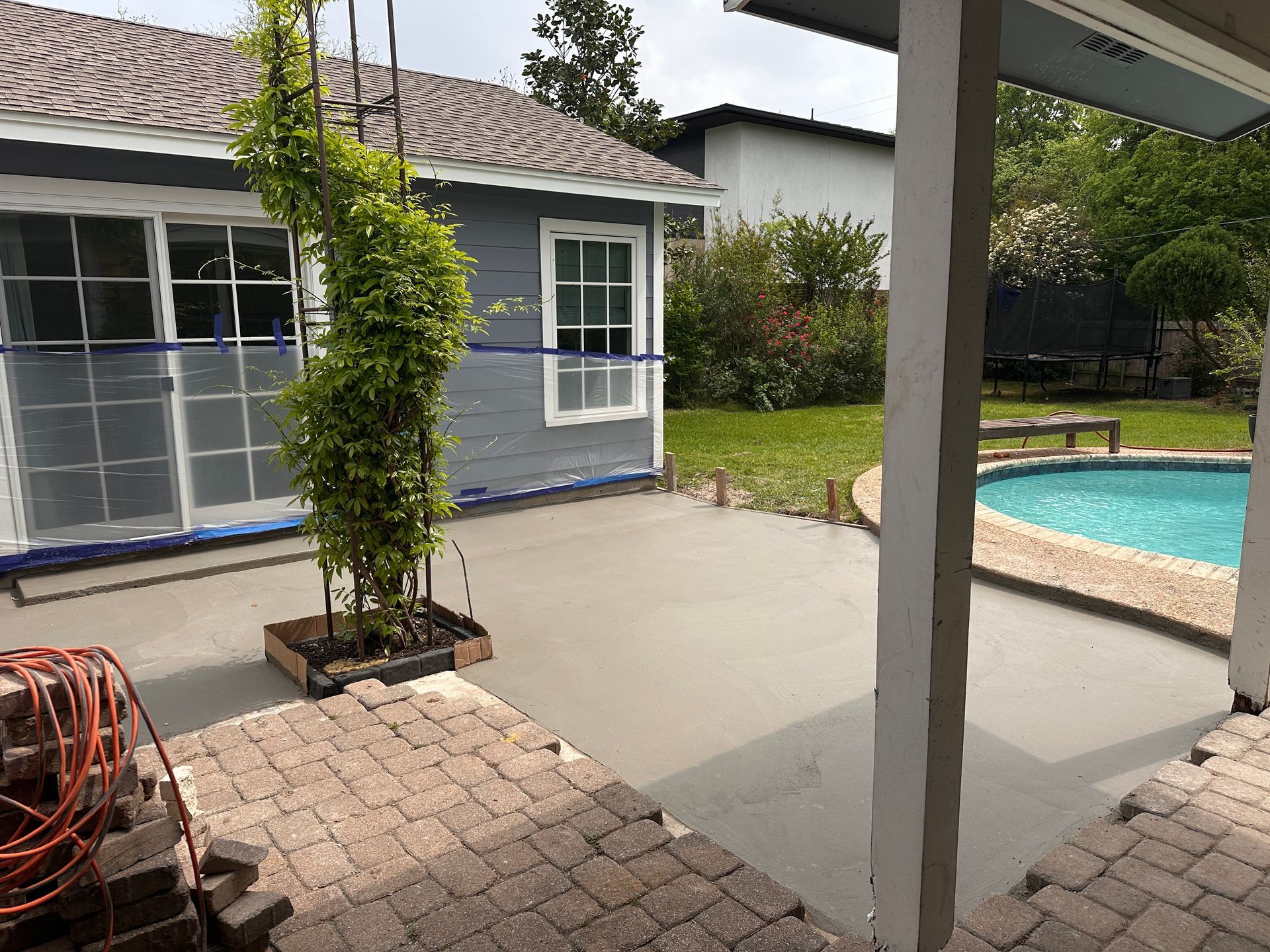 A white house with a table and chairs in front of it