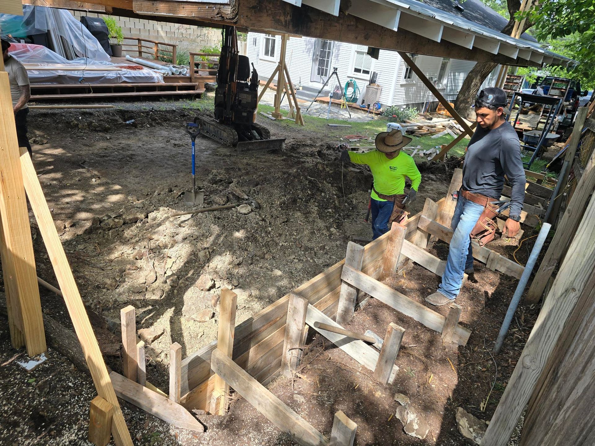 A row of houses with a white picket fence in a residential neighborhood.