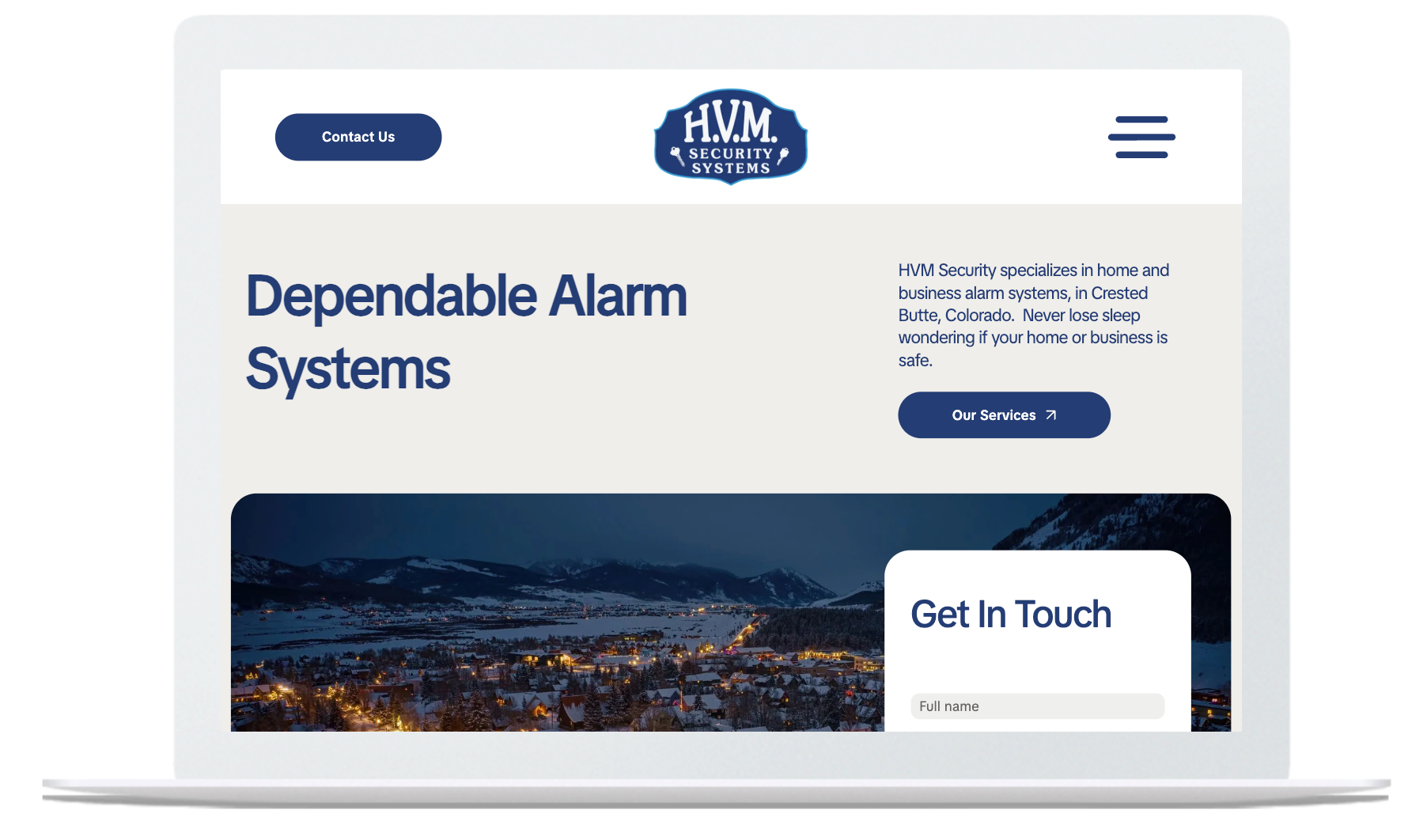 Laptop displaying a website for HVM Security, with text 