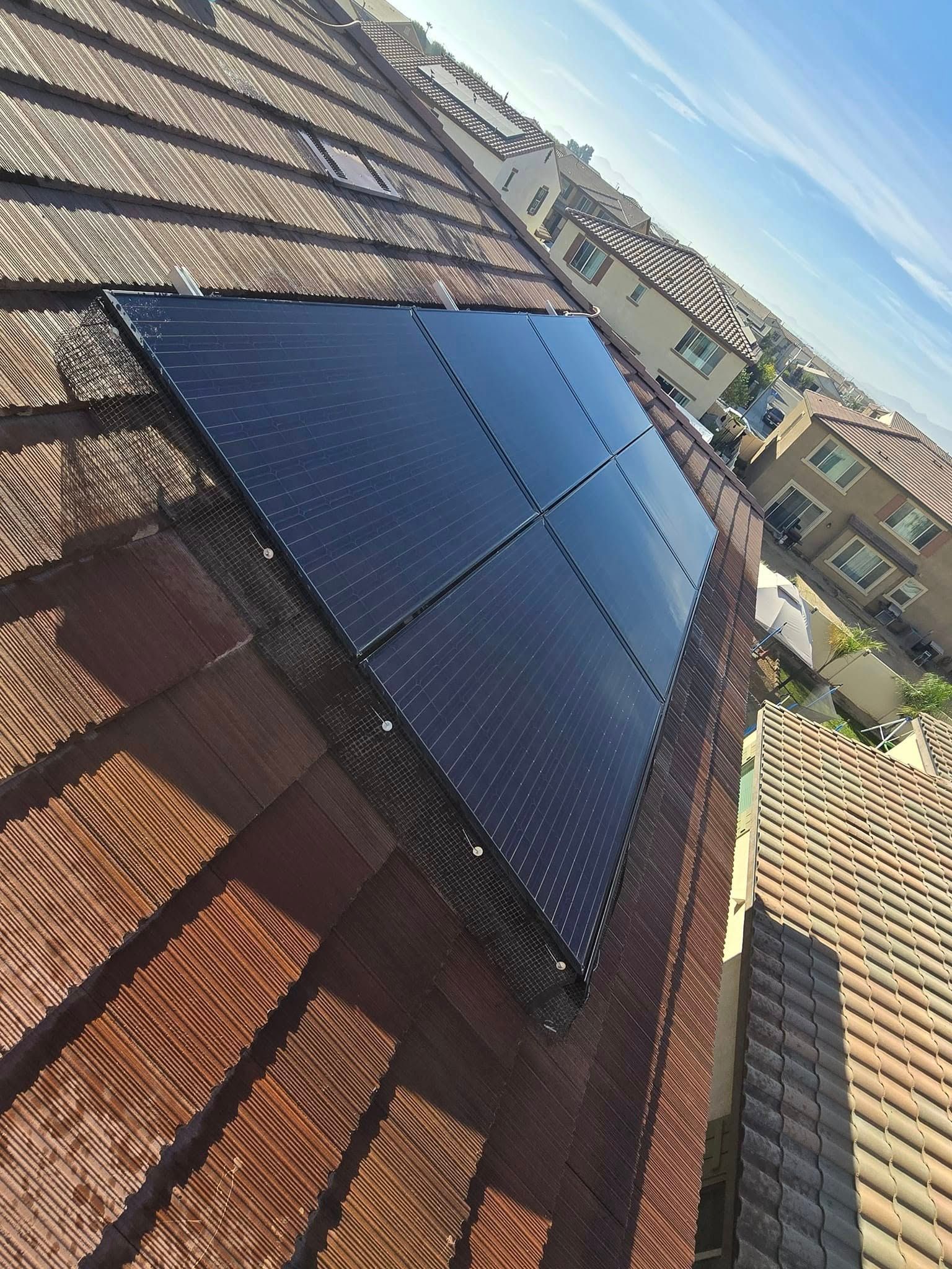 A roof with a lot of solar panels on it