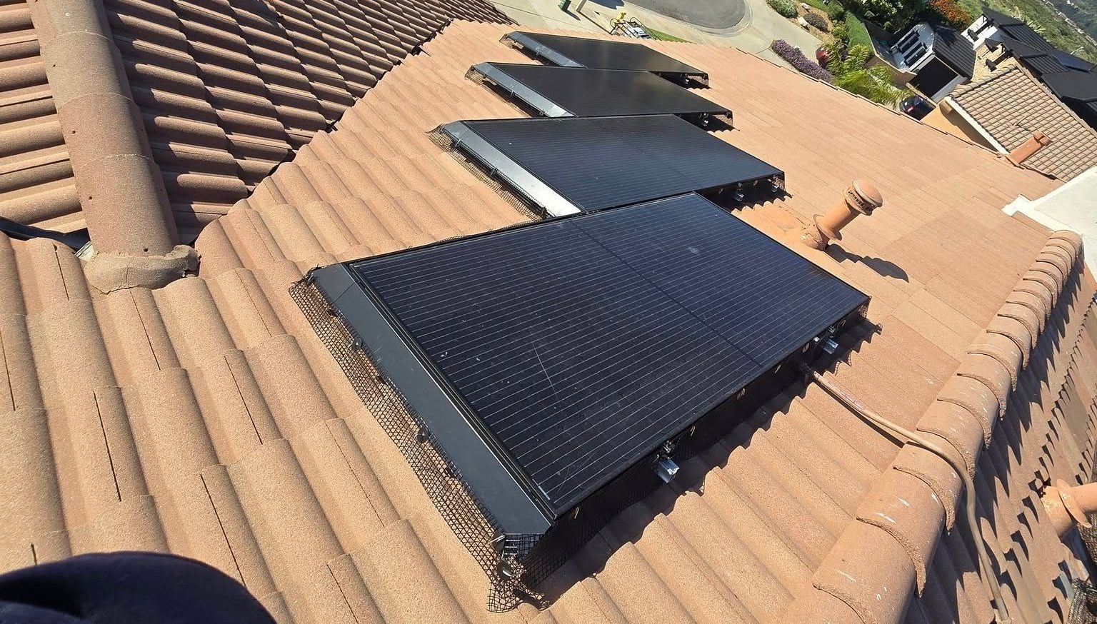 A roof with a bunch of solar panels on it