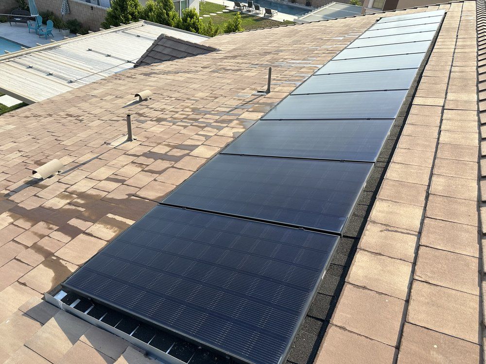 A roof with a lot of solar panels on it