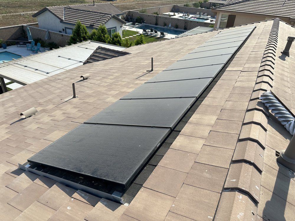 A roof with a lot of solar panels on it