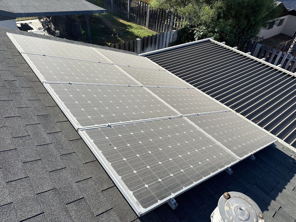 A roof with a lot of solar panels on it