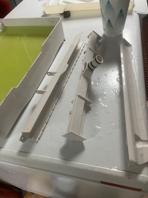 Finished wooden bar top with a glossy epoxy finish. Alternating light and dark wood strips.