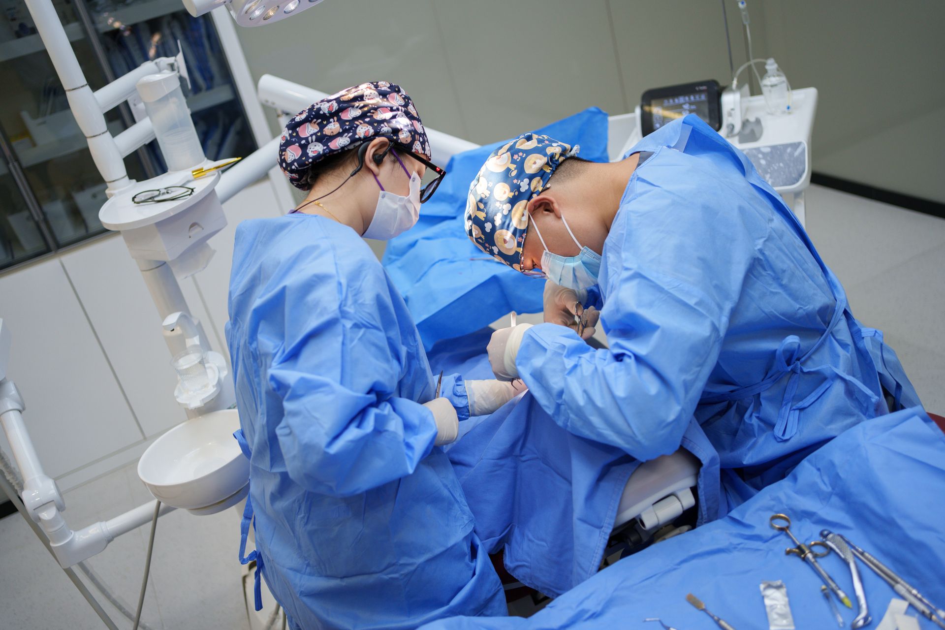A dentist performing oral surgery.