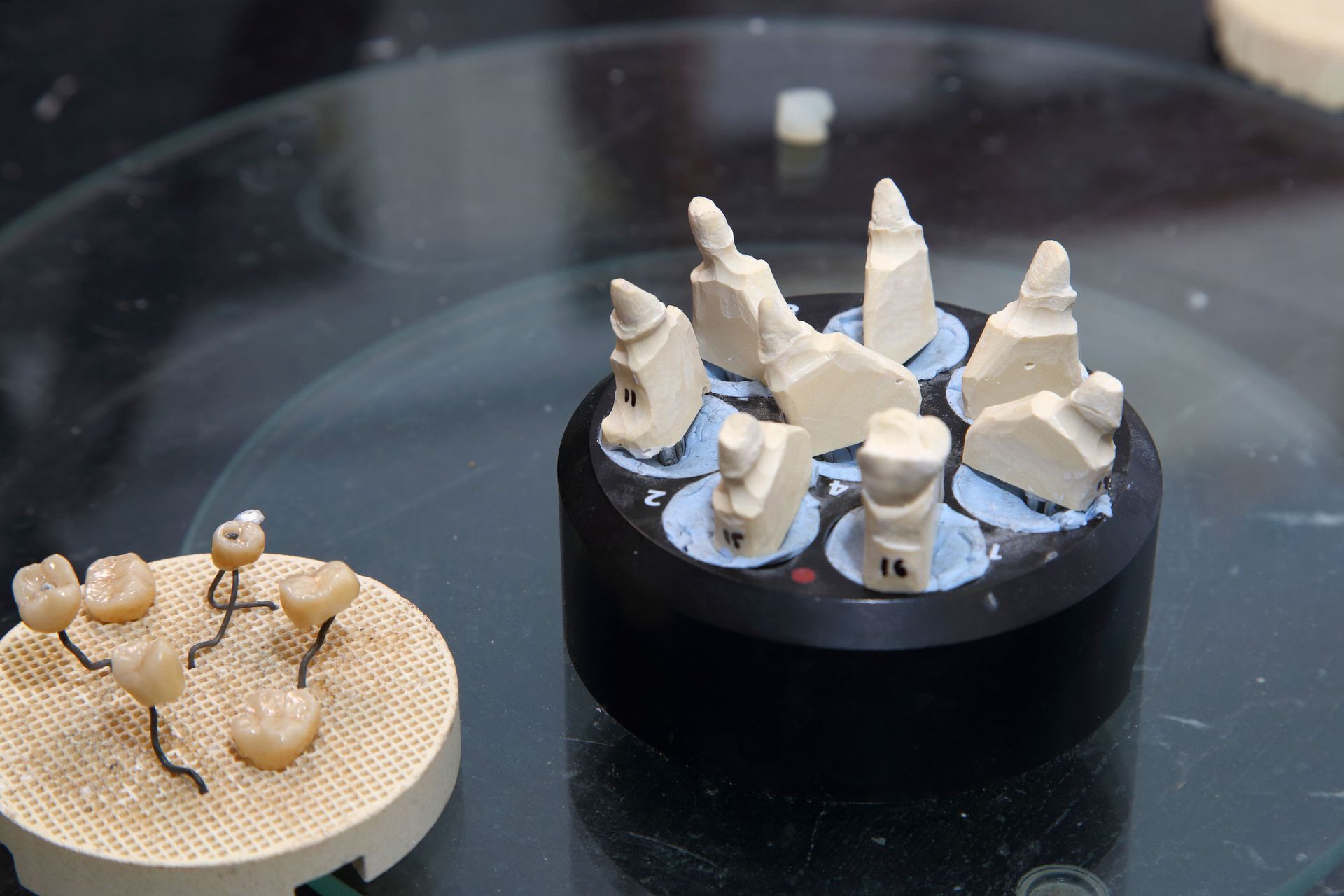 Fabrication of dental crowns and dentures made of ceramic.