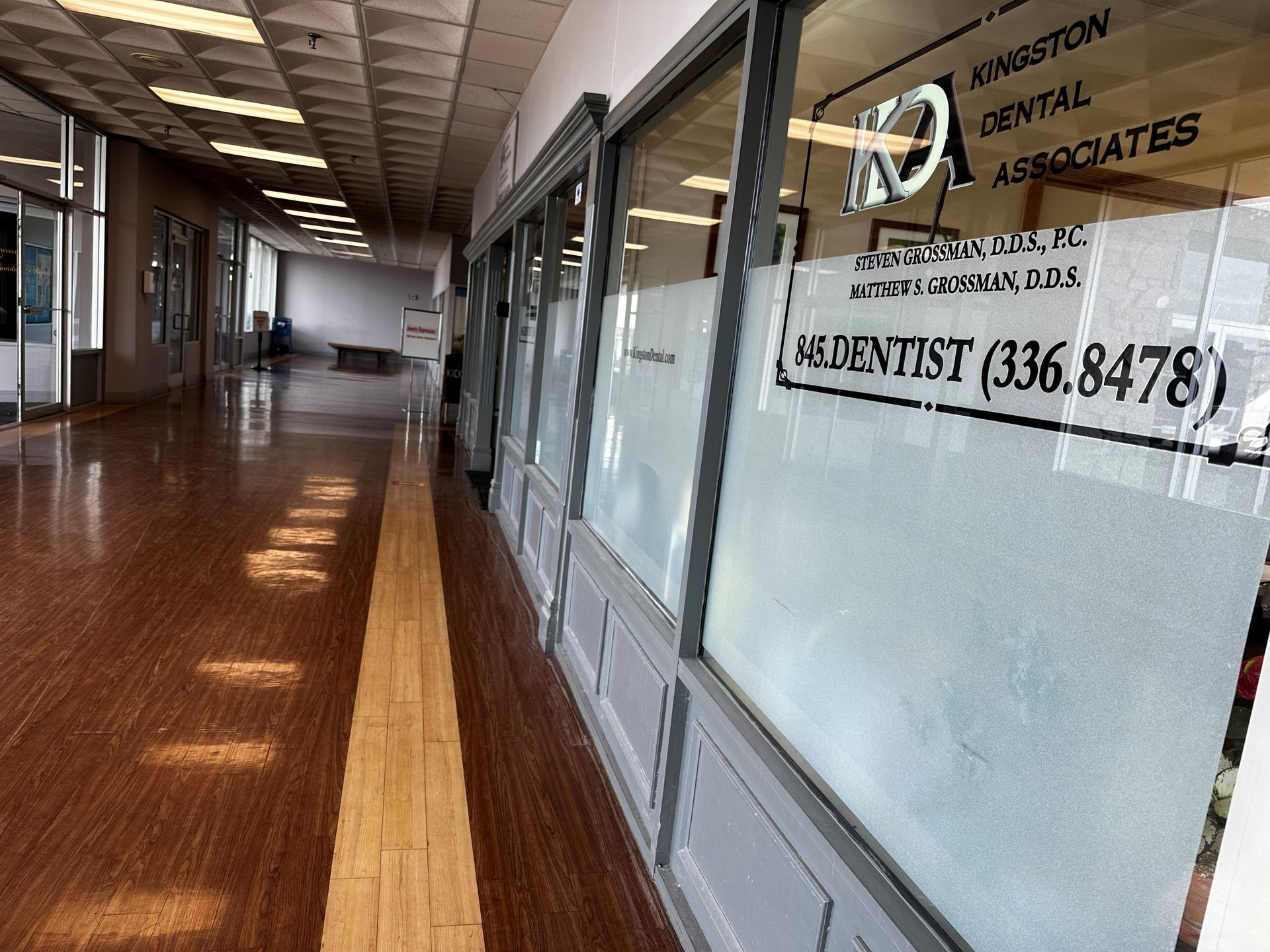 Hallway with storefront of Kingston Dental Associates.