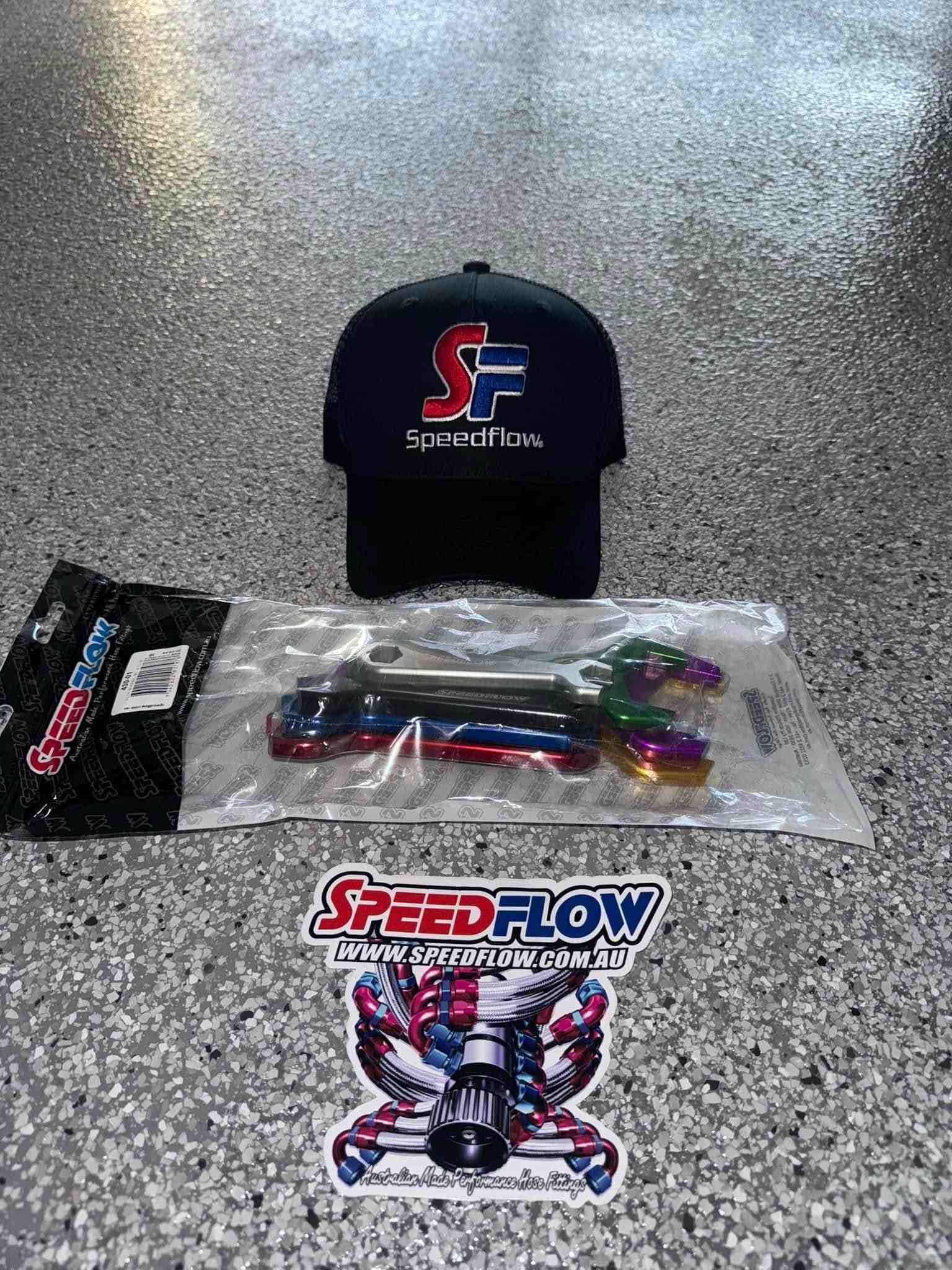 A Baseball Cap and a Sticker Are Sitting on a Concrete Floor — Aushose Canberra In Fyshwick, ACT