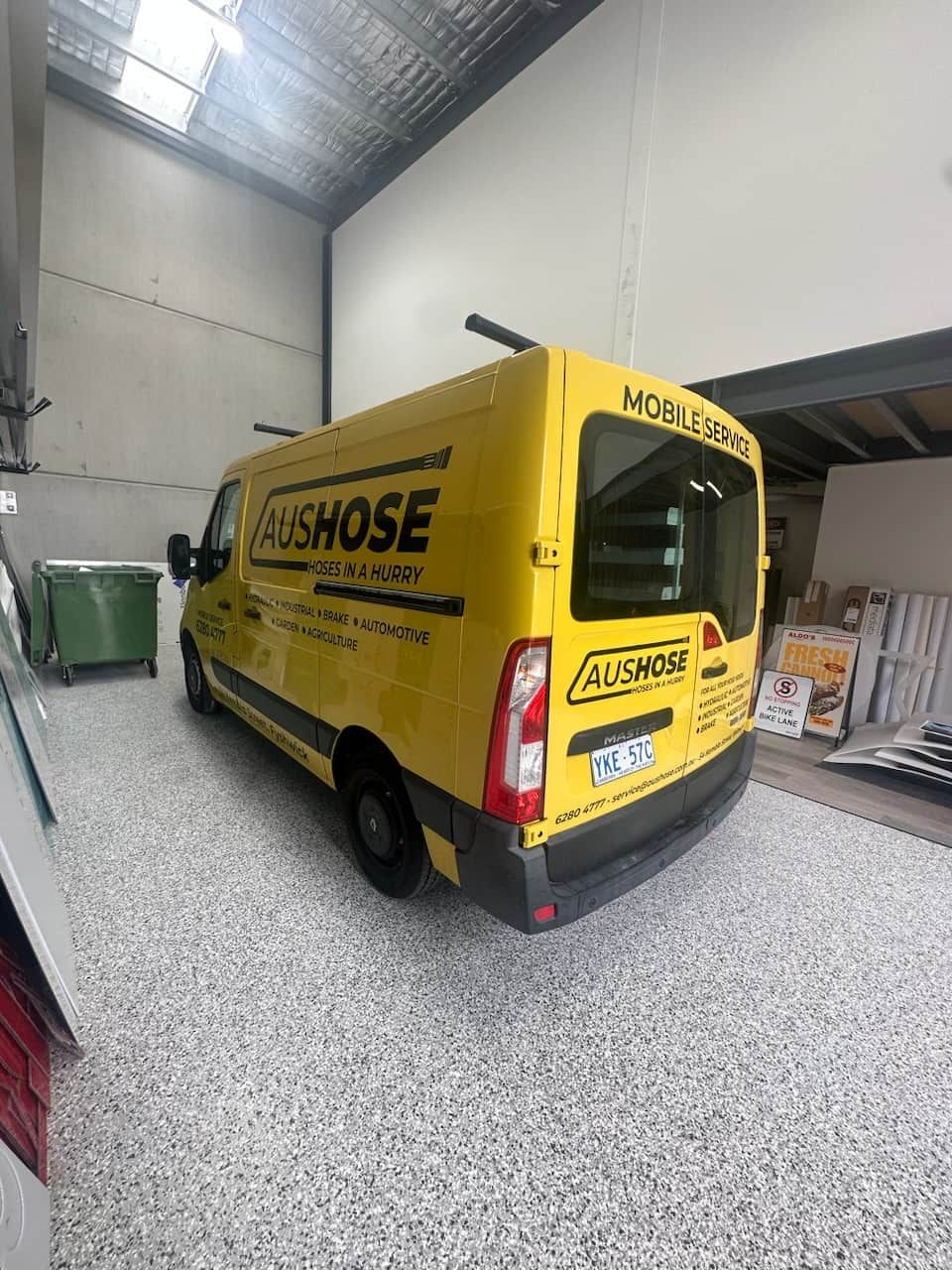 Yellow Van is Parked in a Warehouse — Aushose Canberra In Fyshwick, ACT
