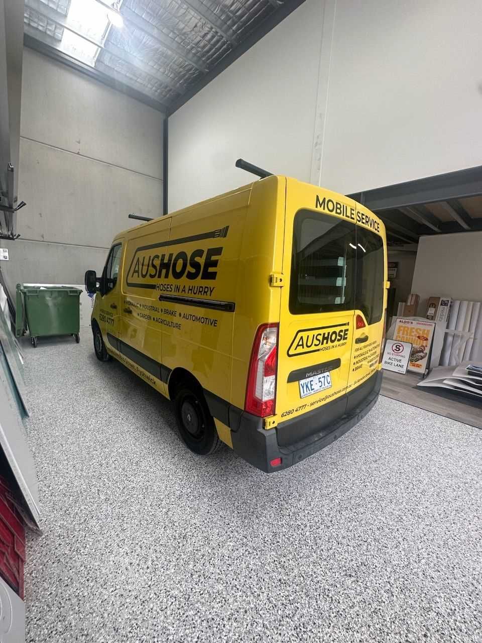 A Yellow Van is Parked in a Warehouse — Aushose Canberra In Fyshwick, ACT
