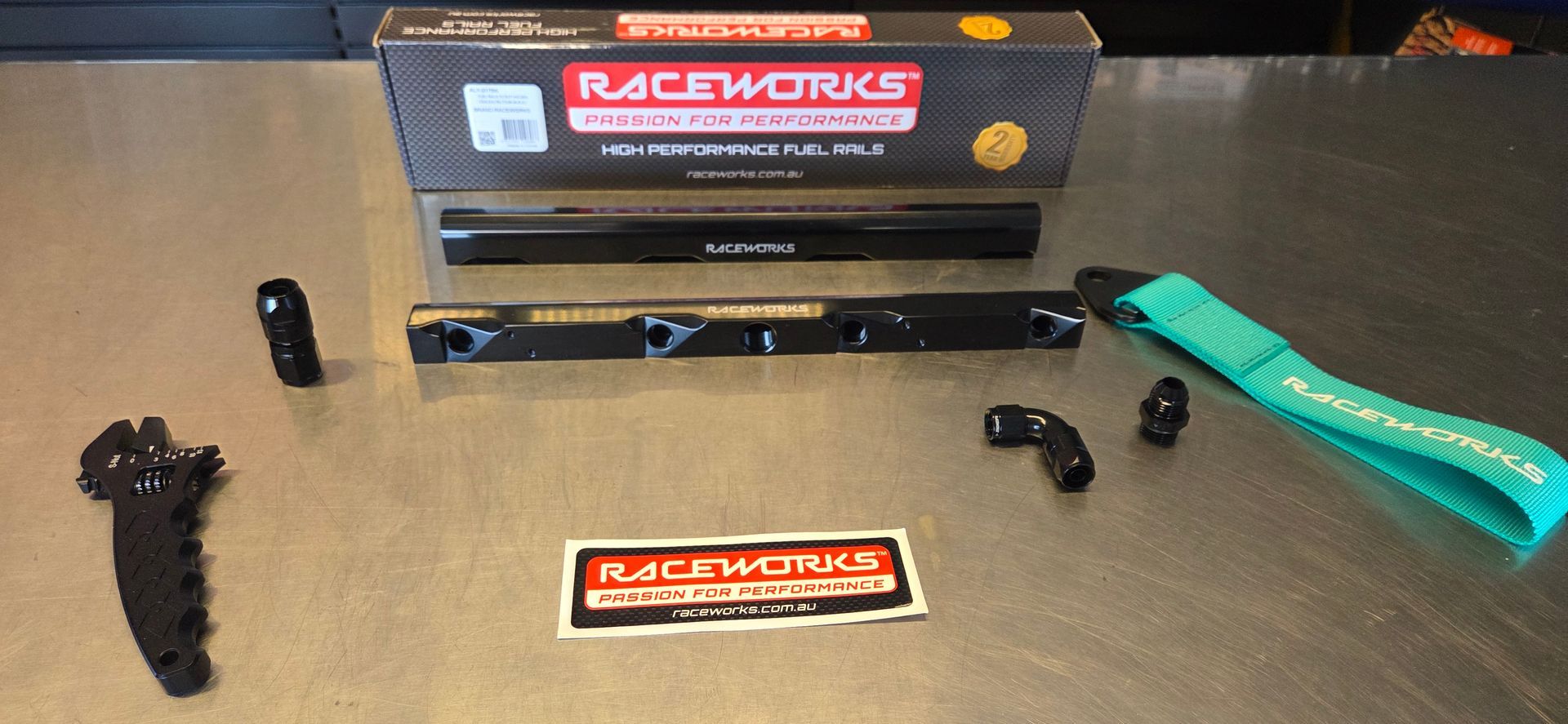 A box of raceworks parts is sitting on a table