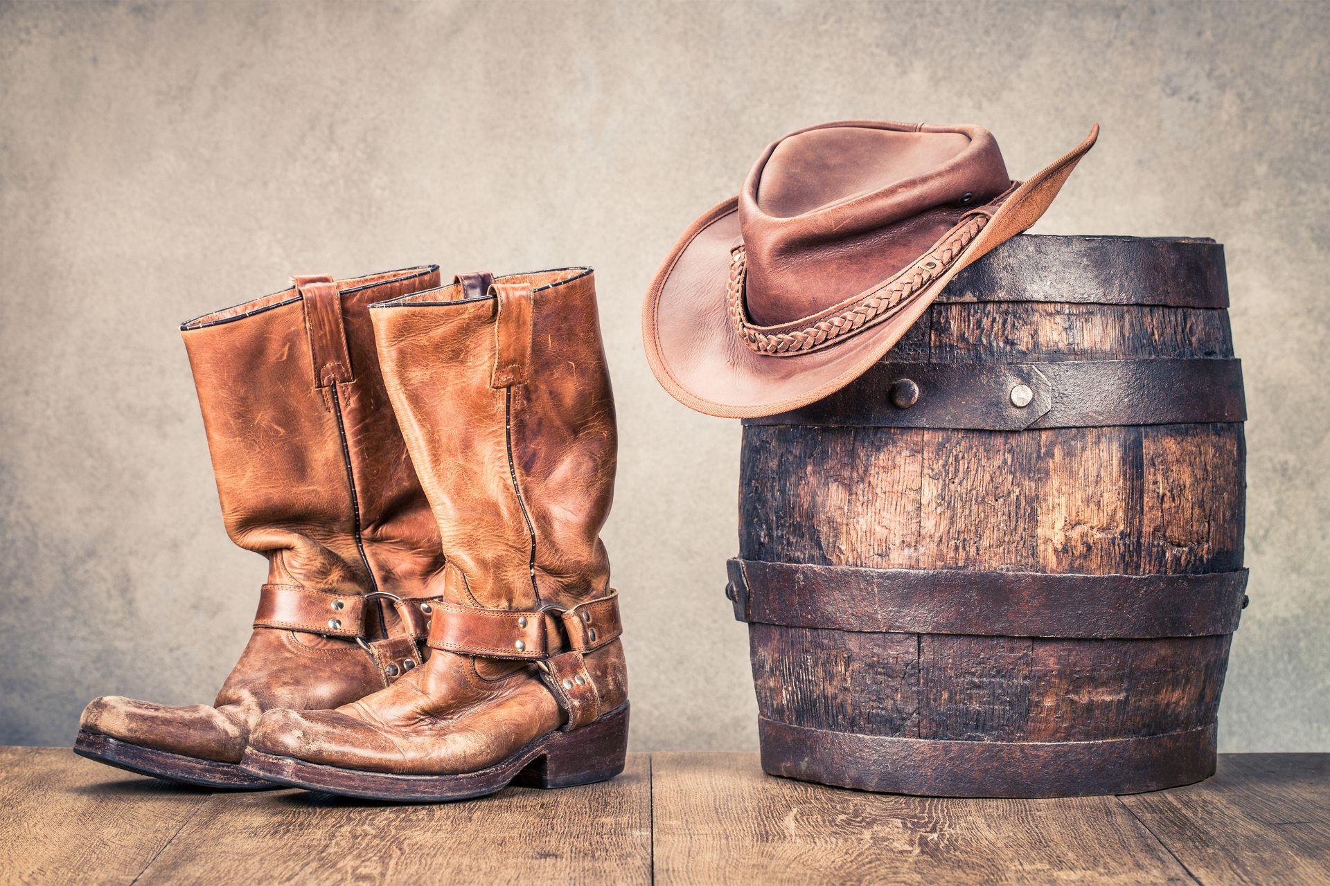 A pontoon boat is floating on a lake with trees in the background