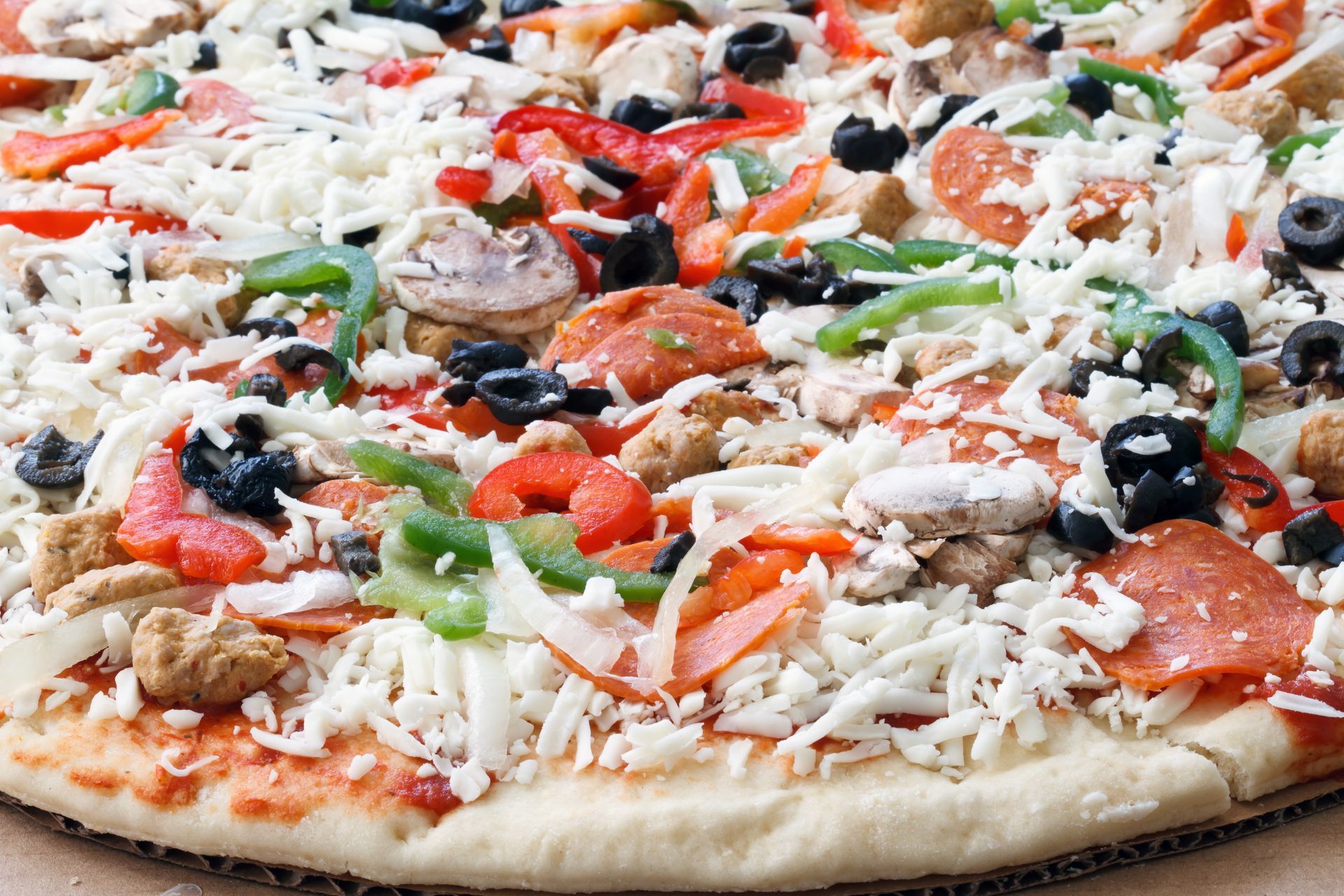 A pizza with a lot of toppings on it