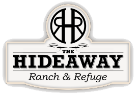 A logo for the hideaway ranch and refuge