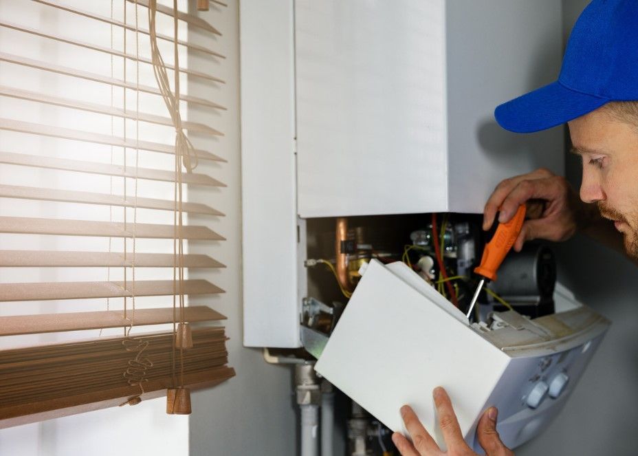 Derbyshire Plumbing & Heating Specialists installing a new boiler in Derby