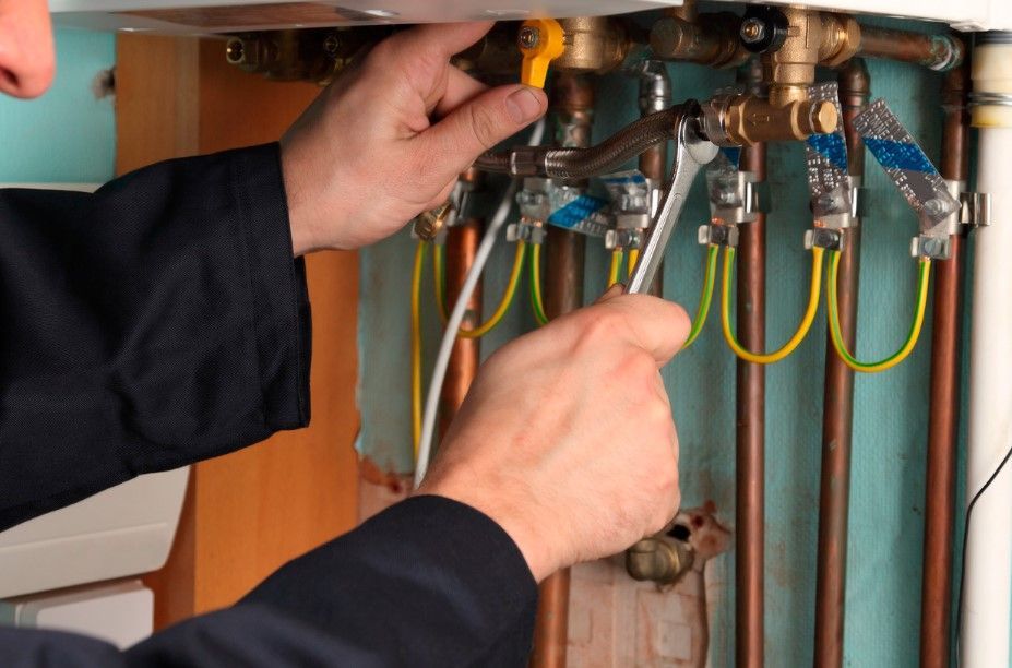 Derbyshire Plumbing & Heating Specialists servicing a combi boiler in Derby