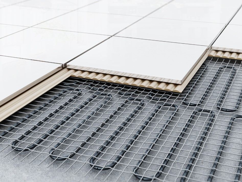 Derbyshire Plumbing & Heating Specialists installing wet underfloor heating in a kitchen in Ilkeston