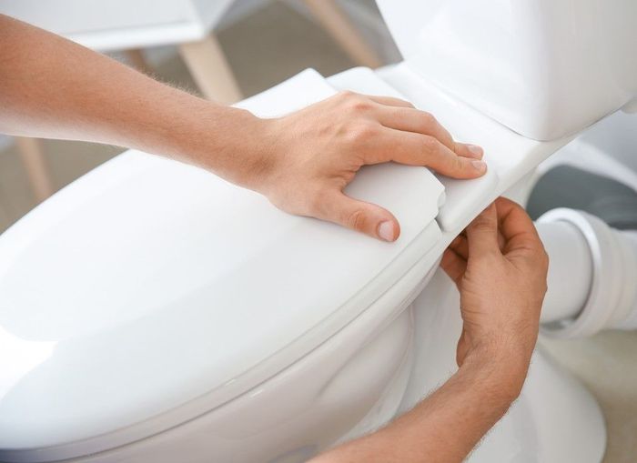 new toilet being installed