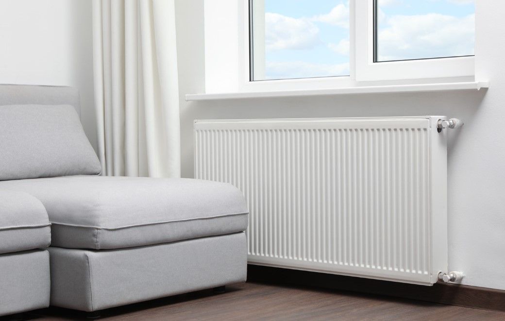 Derbyshire Plumbing & Heating Specialists new radiator installed in a living room in Derby