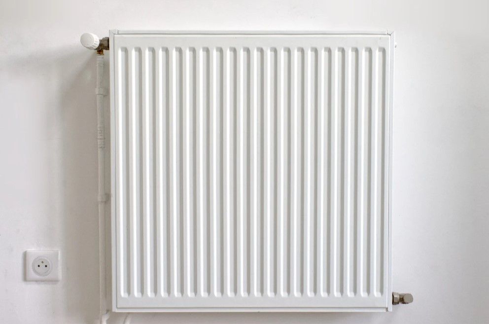 Derbyshire Plumbing & Heating Specialists about to carry out a radiator power flush in Ilkeston