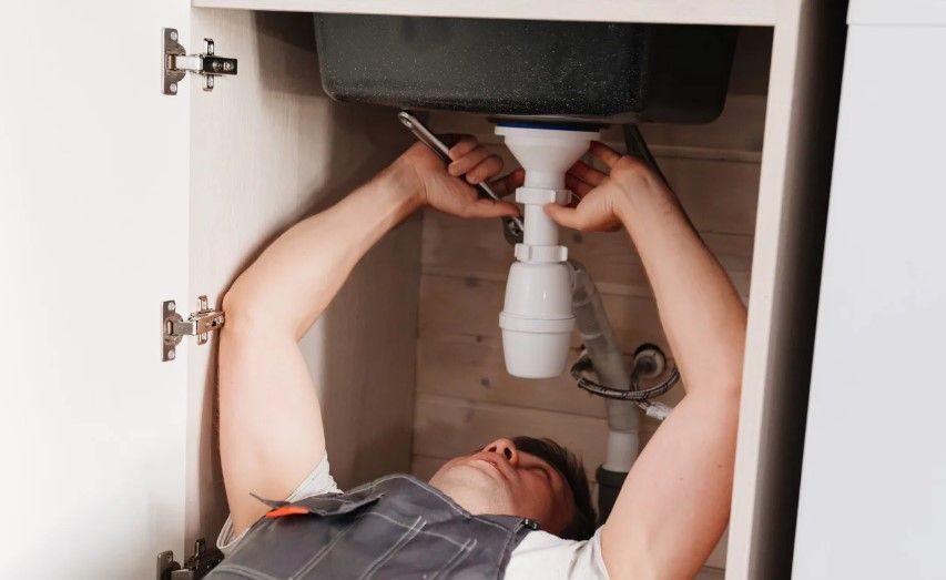 Derbyshire Plumbing & Heating Specialists unblocking a kitchen sink in Derby