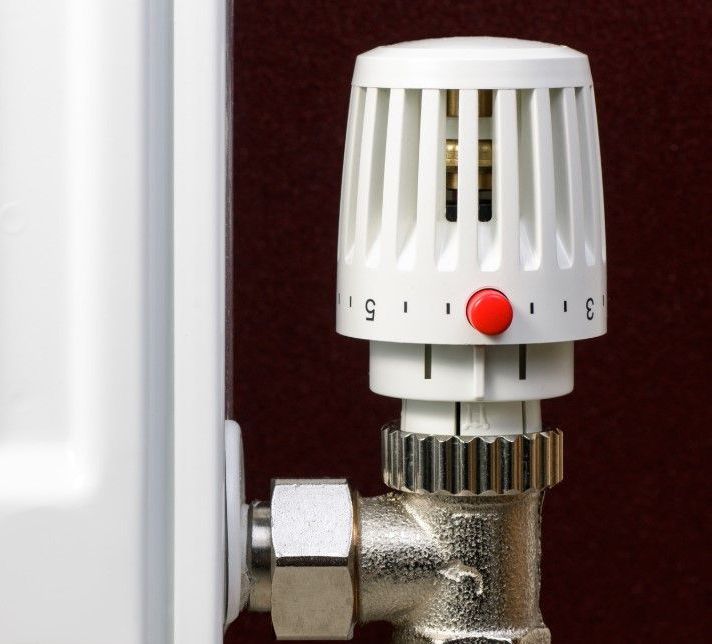 Derbyshire Plumbing & Heating Specialists installing a smart thermostat in Derby