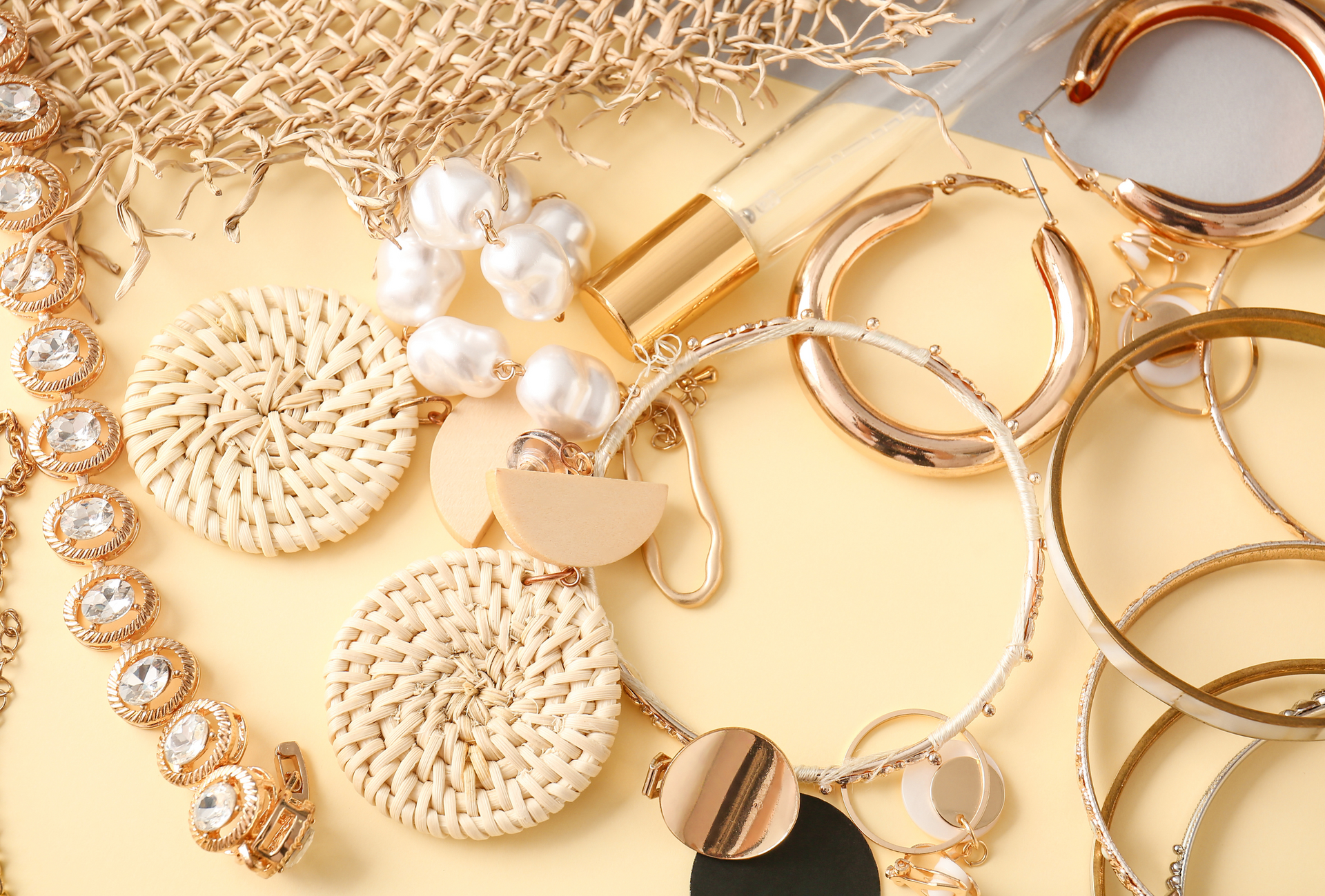 variety of earrings, jewelry and perfume