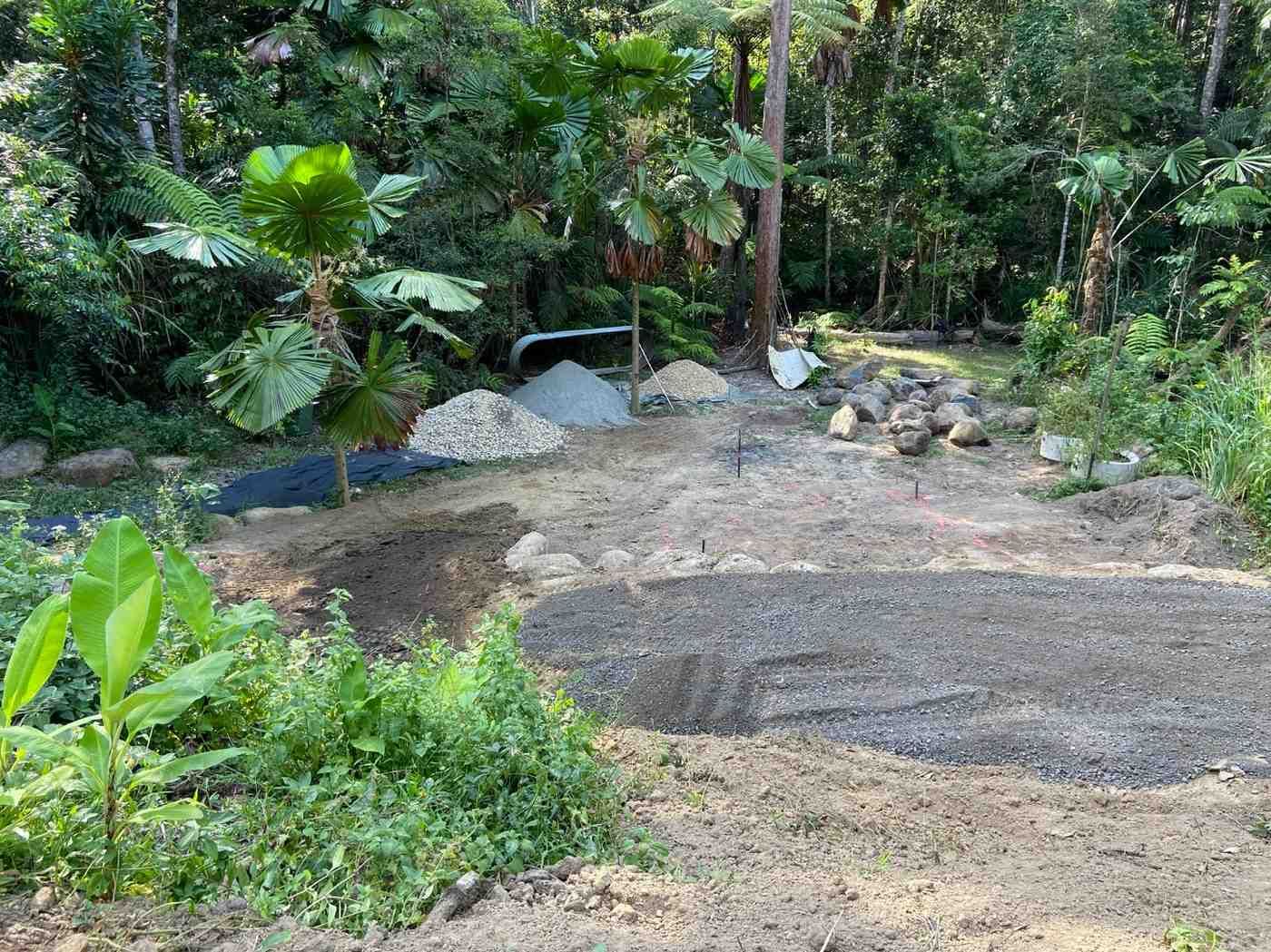 A Dirt Road in the Middle of a Lush Green Forest — RCJJ Mini Loaders In Cairns, QLD