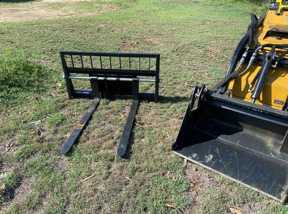 Mini Loader Parked on Field with Extension on its Side — RCJJ Mini Loaders In Mareeba, QLD